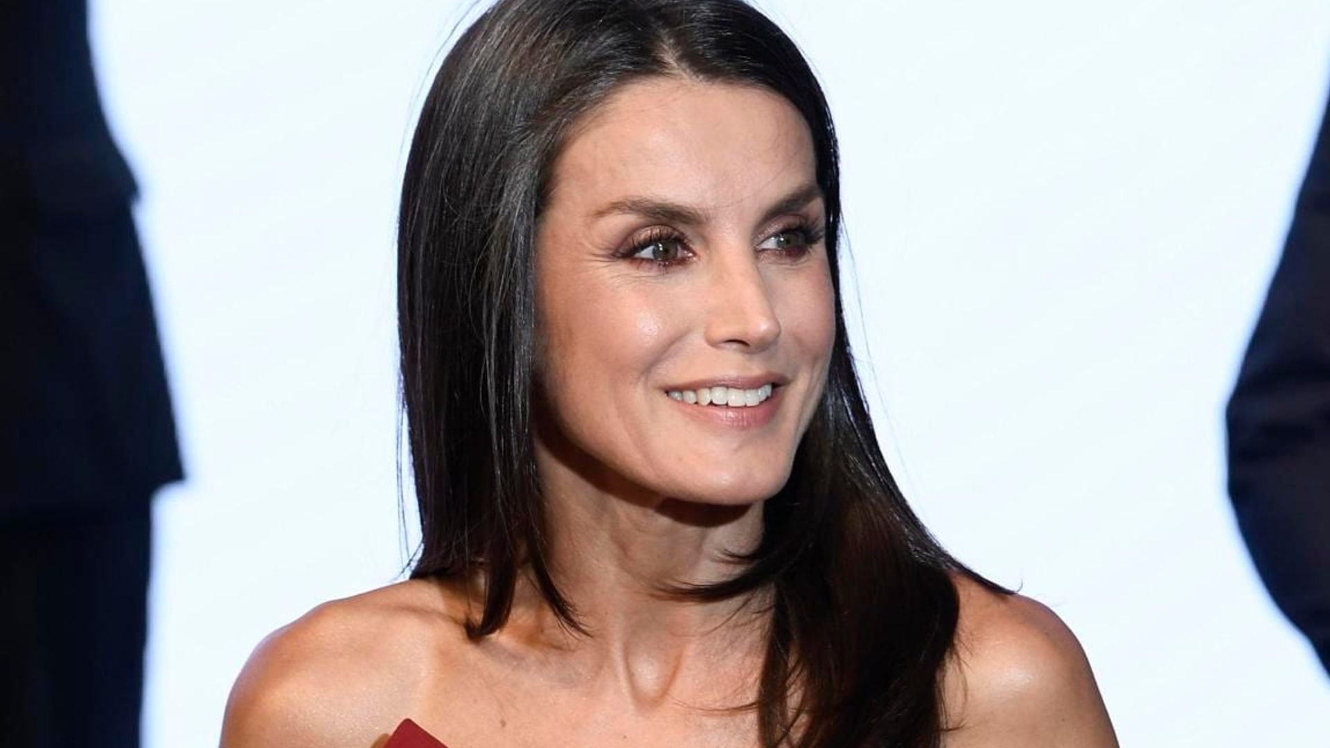 Queen Letizia perfectly matches her dress to her go-to face mask