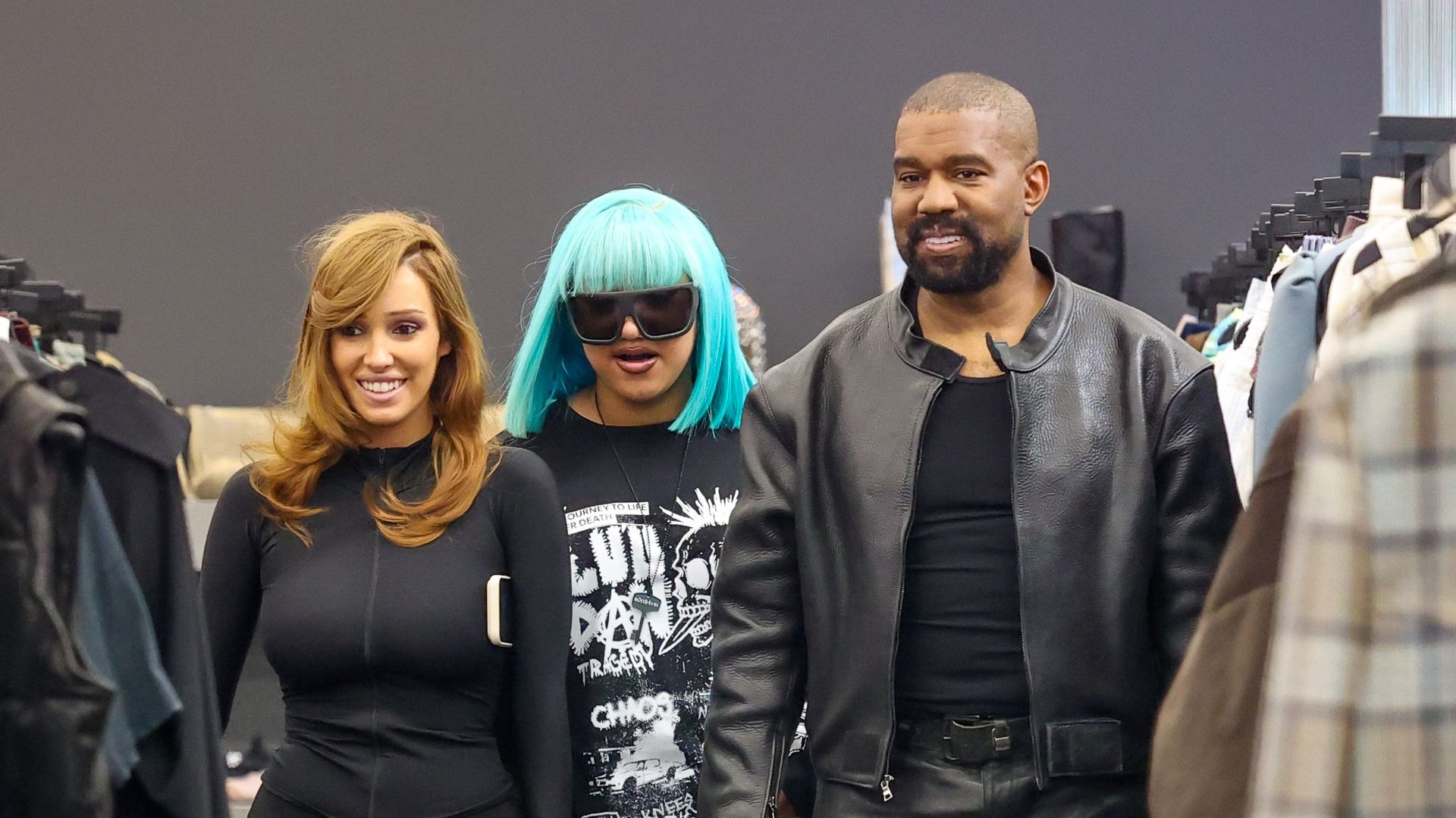 North's colorful hair ensured she remained the center of attention as the family browsed clothing racks inside the boutique.