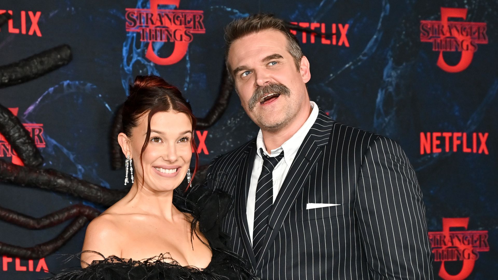 Millie Bobby Brown and David Harbour at the "Stranger Things" Season 5 World Premiere held at the TCL Chinese Theatre on November 06, 2025 in Los Angeles, California. (Photo by Michael Buckner/Variety via Getty Images) 