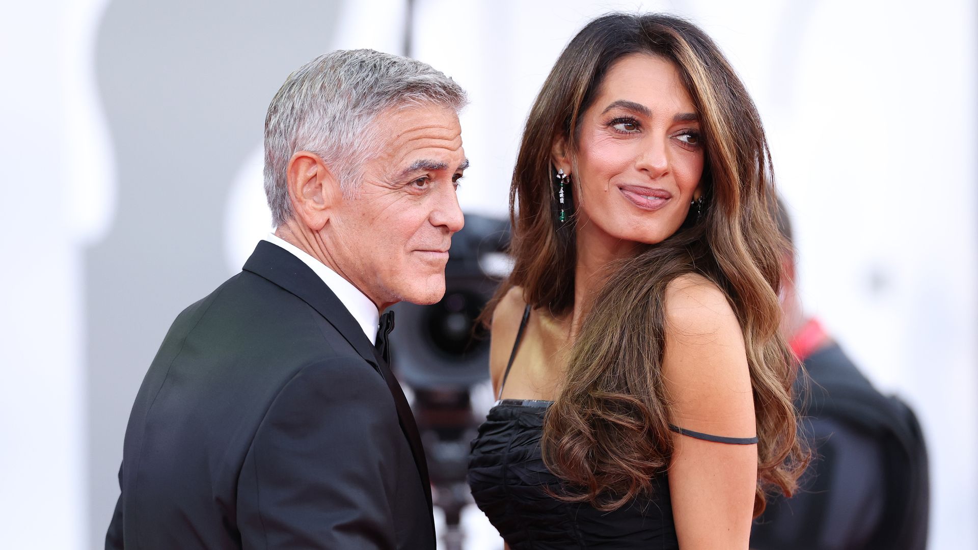 Amal Clooney makes glamorous red carpet return and shares tender moment with George