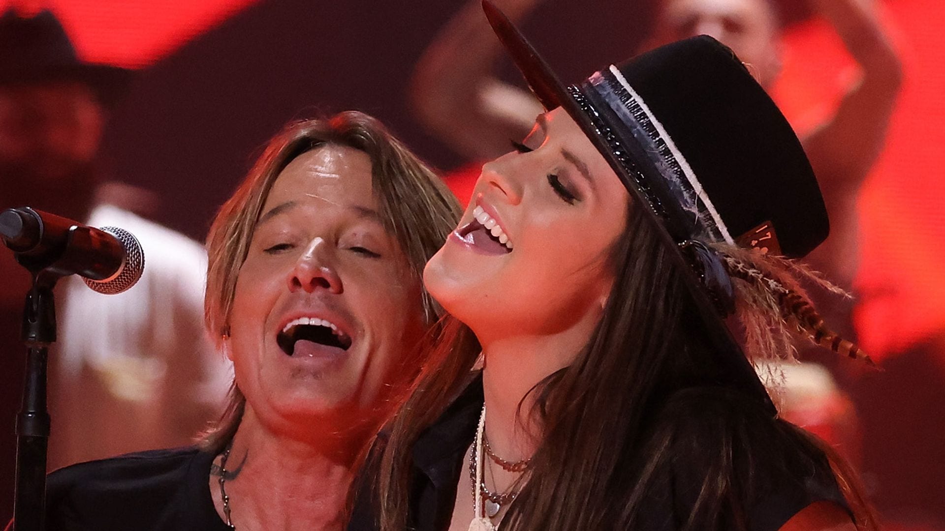  Anna Vaus, Keith Urban, and Maggie Baugh perform during the 2024 CMT Music Awards at Moody Center on April 07, 2024 in Austin, Texas. 