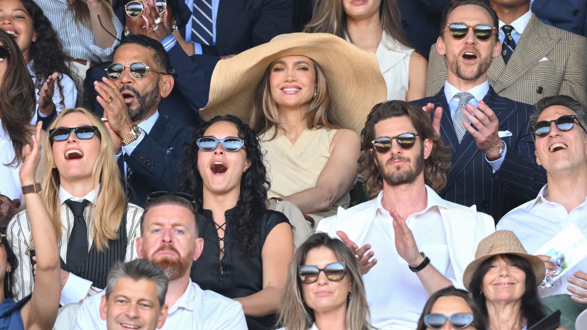 Jennifer Lopez becomes the center of attention with a wide-brim hat in a sea of sunglasses