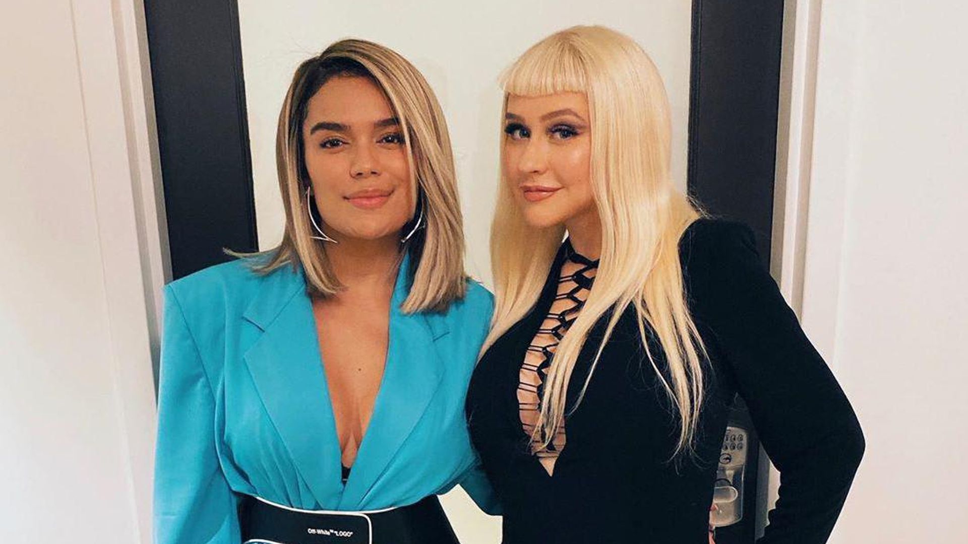 Karol G hangs out with Christina Aguilera at ‘The Addams Family’ premiere