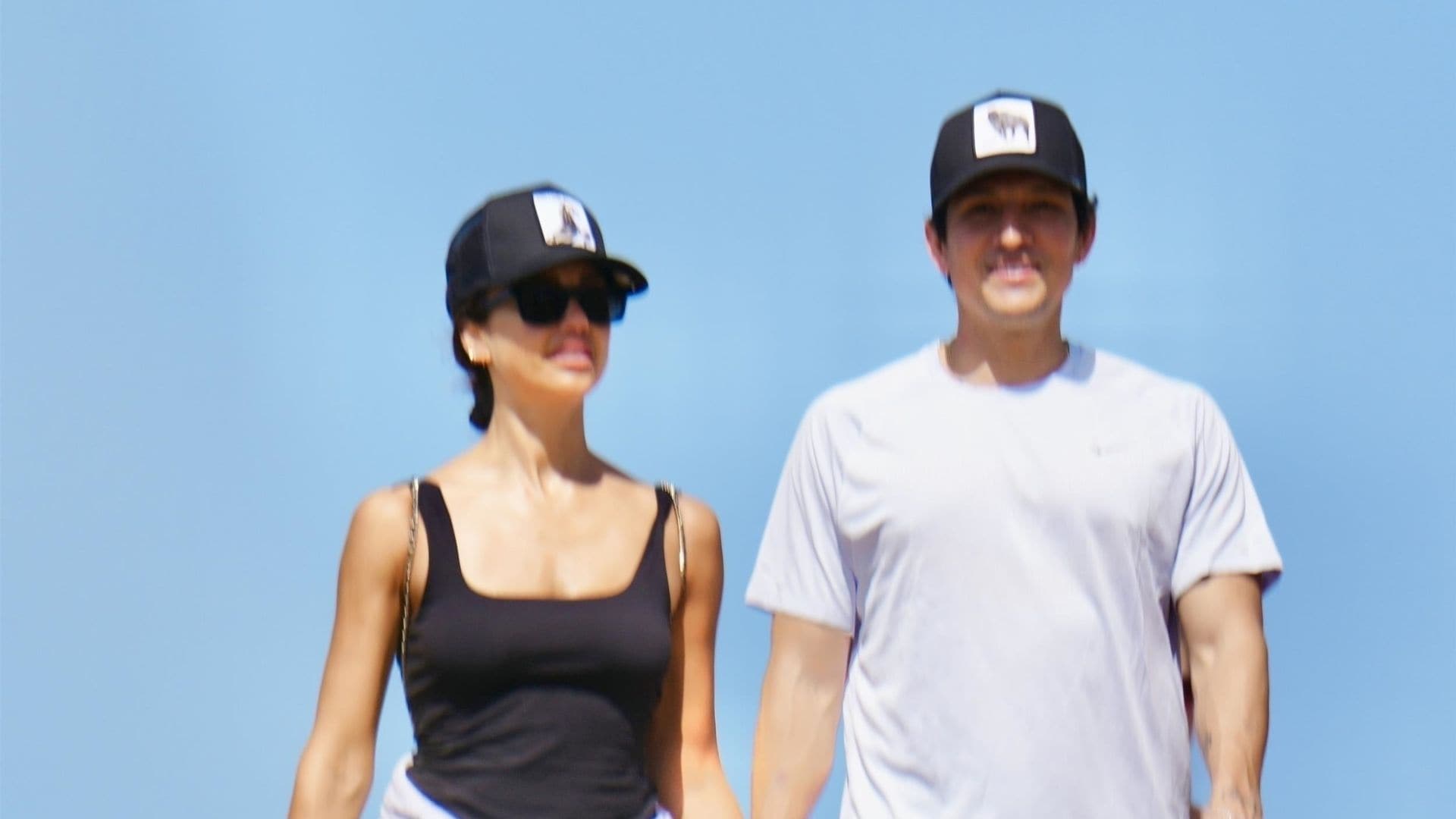 The two were spotted laughing, holding hands, and embracing as they wandered along the oceanfront path.