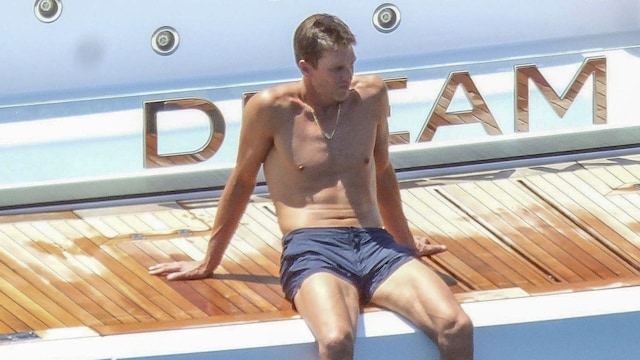 Tom showed off his tan and abs in Ibiza