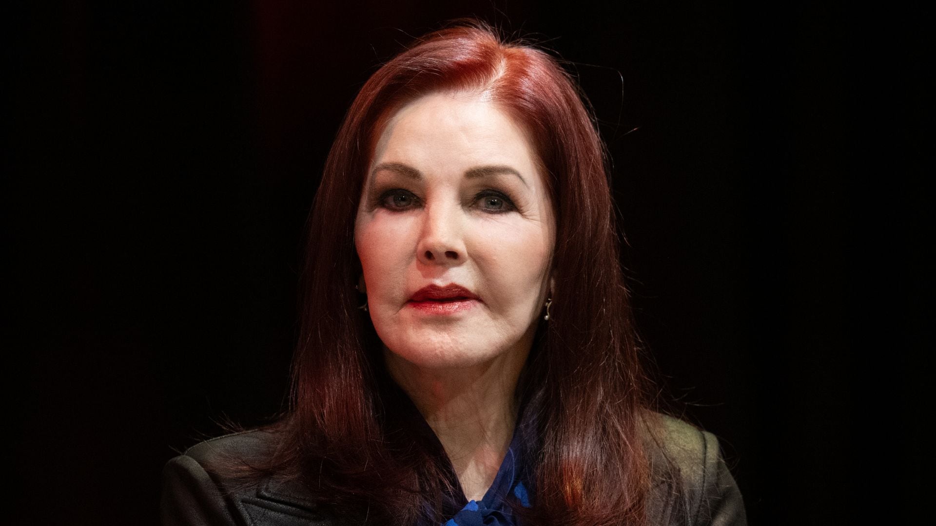 Priscilla Presley speaks at a press conference ahead of her talk show "An intimate evening with Priscilla Presley". Presley is a guest at the Jugendstil Theater with her talk show. Photo: Boris Roessler/dpa (Photo by Boris Roessler/picture alliance via Getty Images)