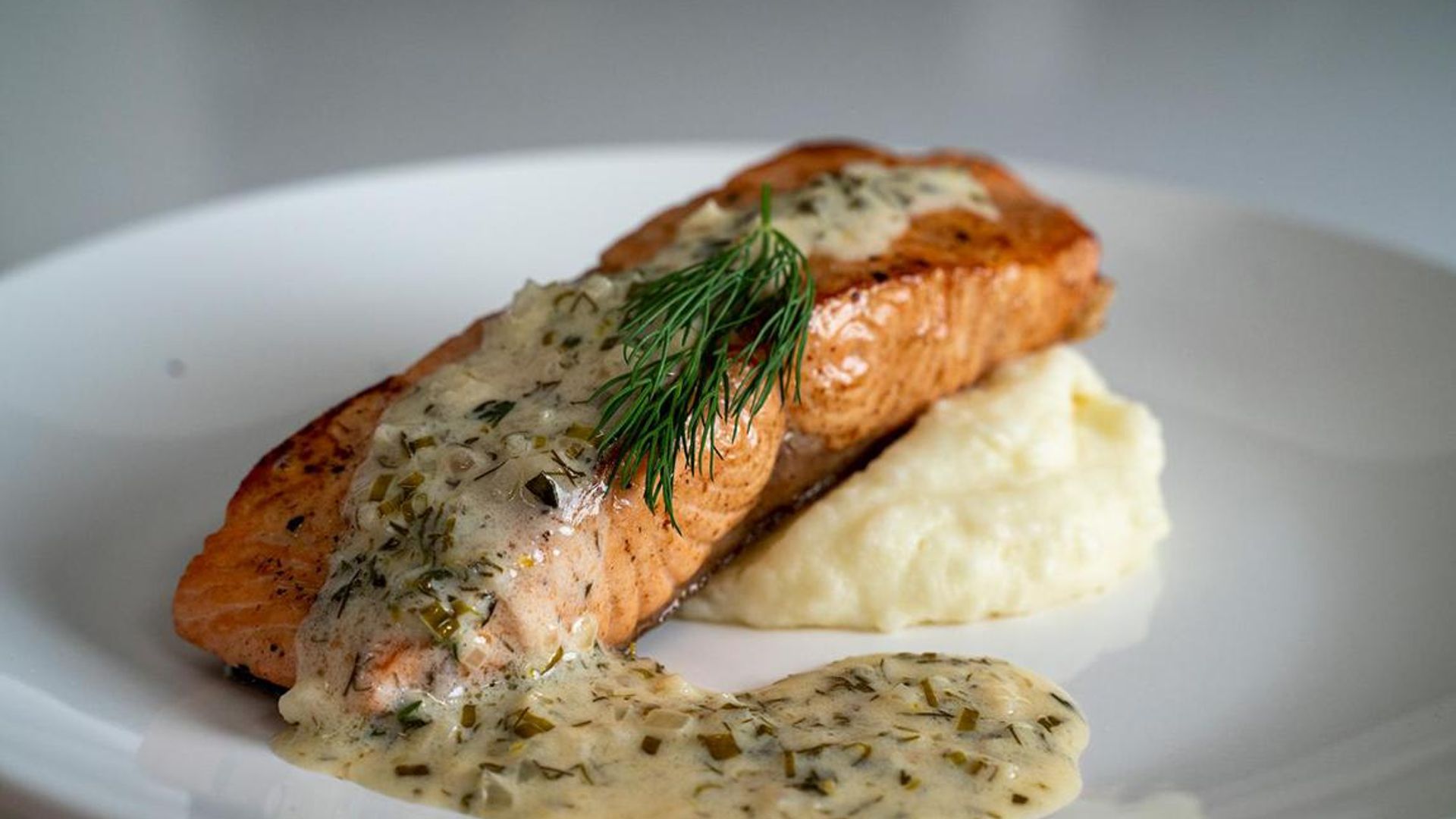 Cook at home like a chef with the perfect dinner recipe: Pan-seared salmon with a lemon and herb butter sauce