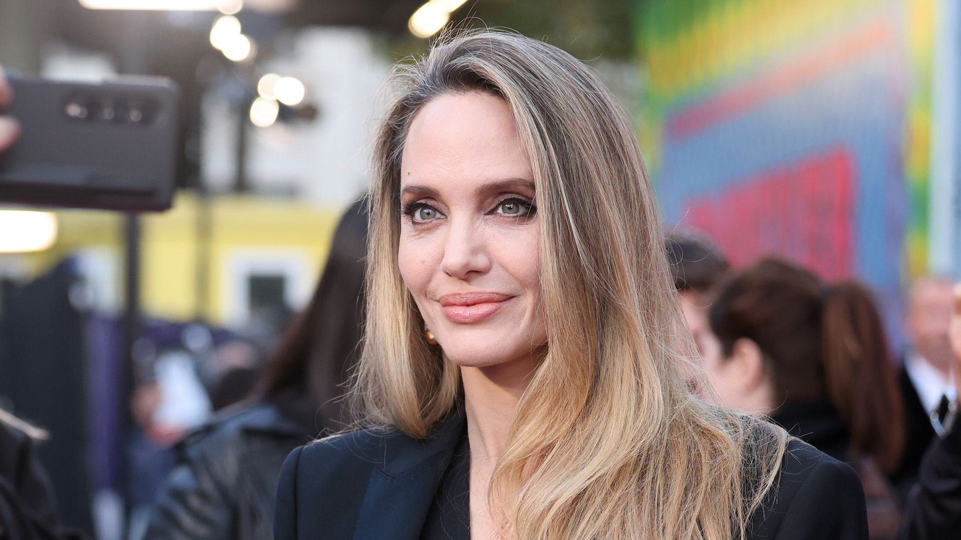 Angelina Jolie signing autographs and posing for selfies with fans at the "Maria" Headline Gala during the 68th BFI London Film Festival at The Royal Festival Hall on October 18, 2024 in London, England. (Photo by Neil Mockford/Getty Images for BFI)