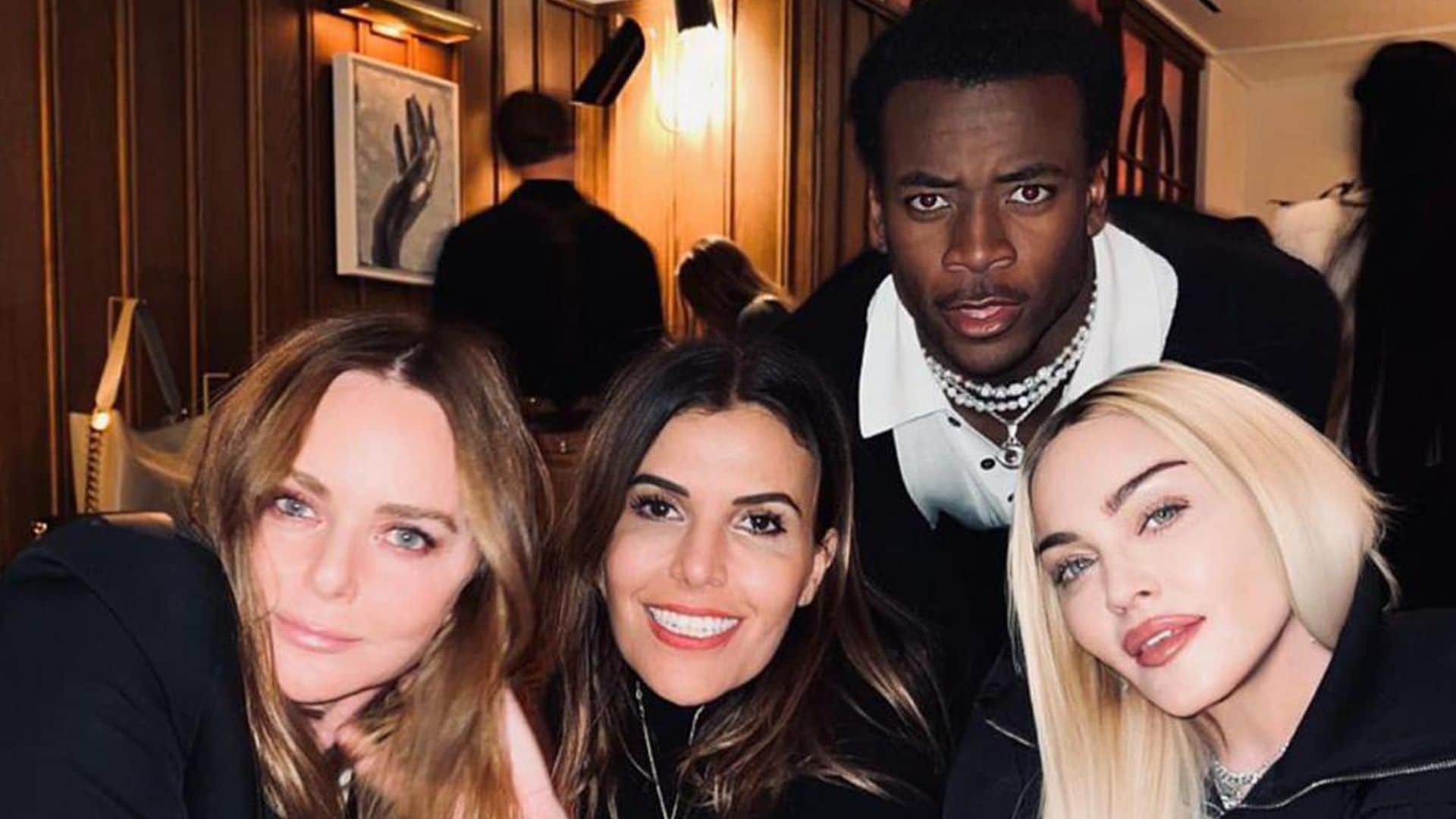 Madonna sips wine during a night out with her besties and son David Banda