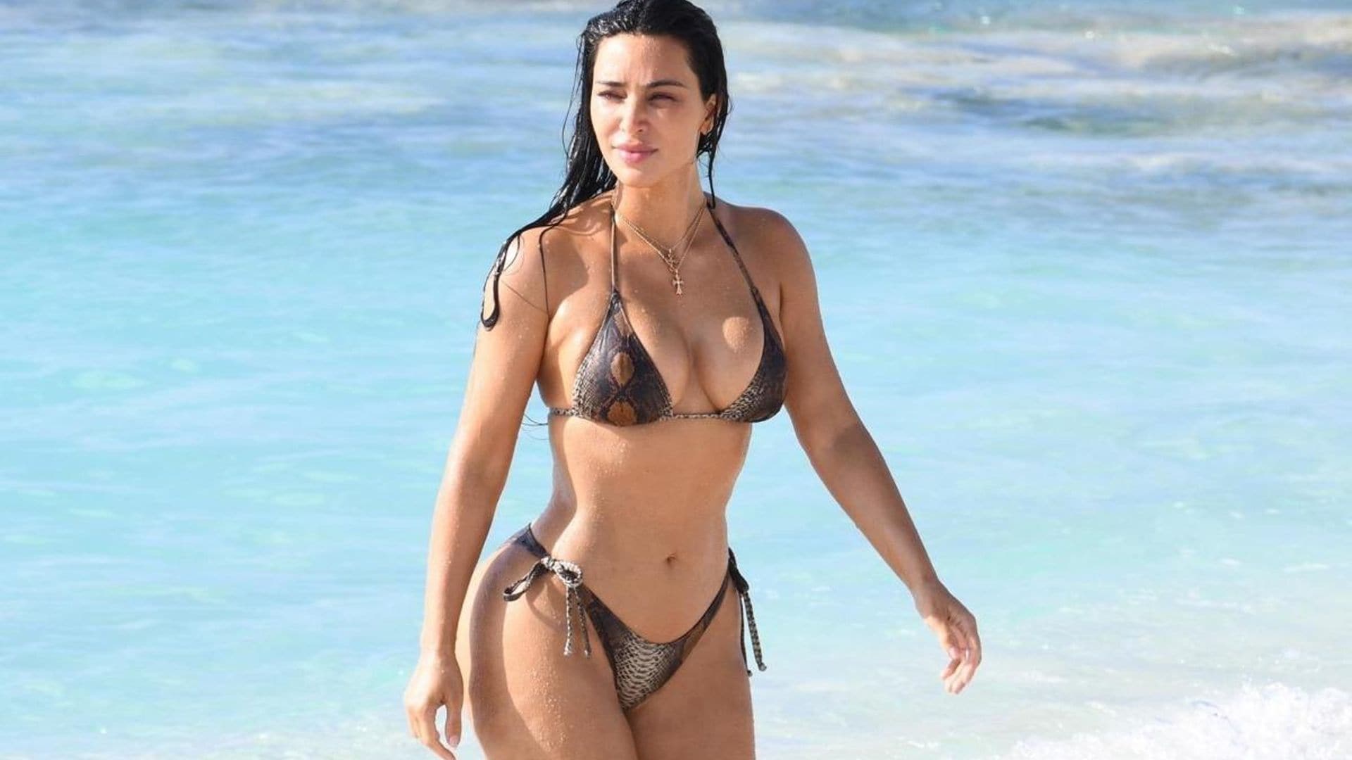 Kim and Khloé Kardashian turn up the heat in snakeskin bikinis at the beach