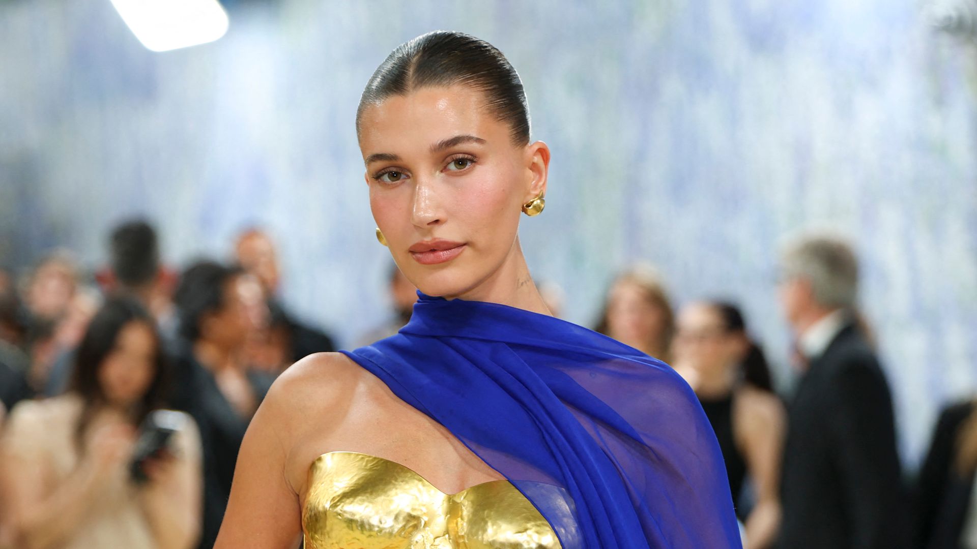Hailey Bieber stuns in a string bikini and debuts a tattoo seemingly inspired by her son