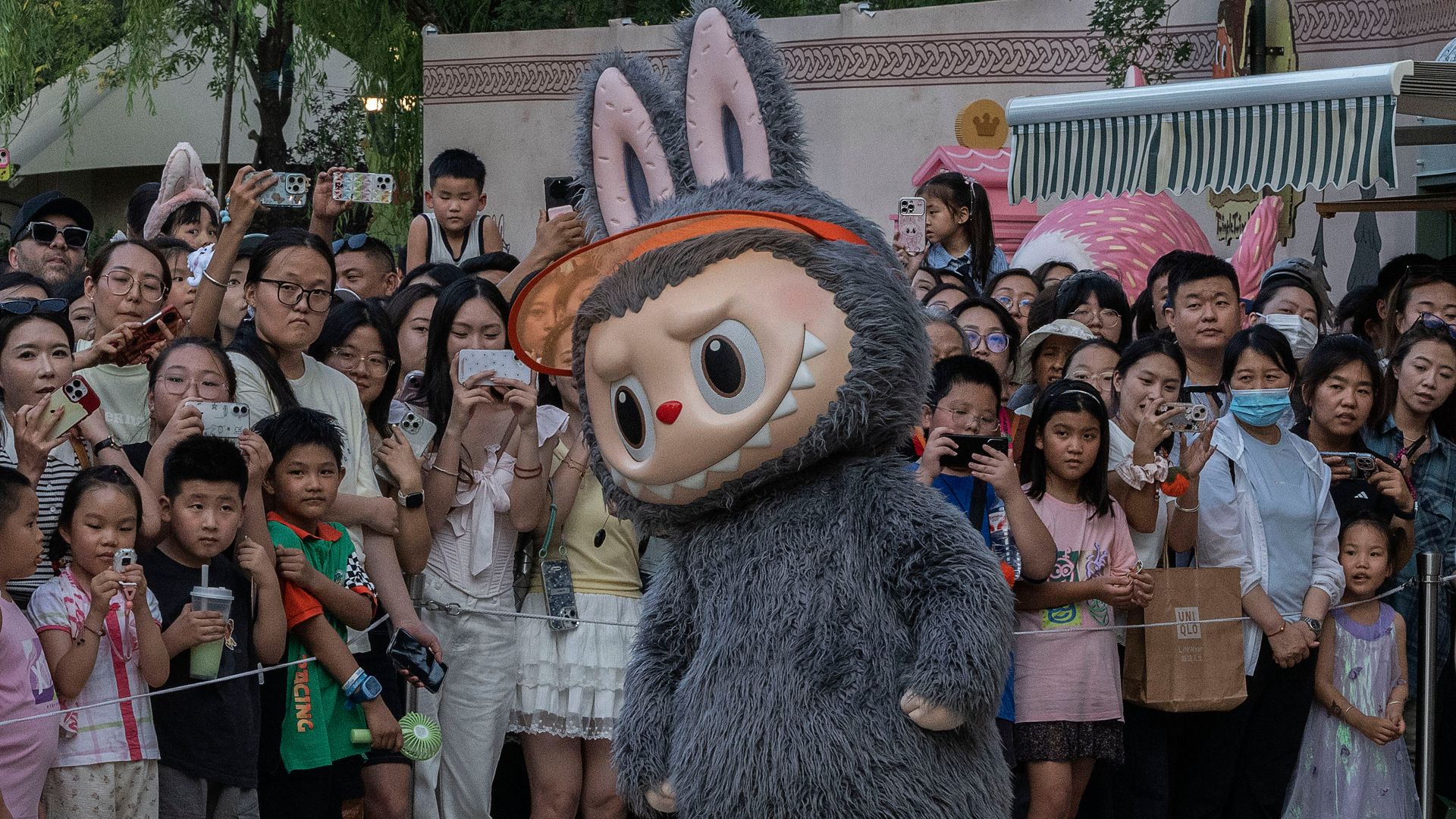 Labubu dolls series while dancing for visitors at the Pop Land theme park on July 17, 2025 in Beijing, China.