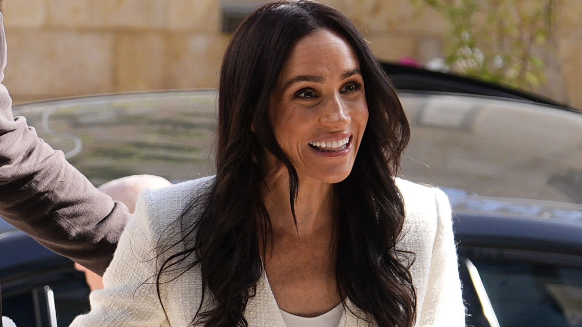 Meghan Markle channels Carolyn Bessette-Kennedy in corset-style gown with sleek column silhouette and heirloom gold jewelry