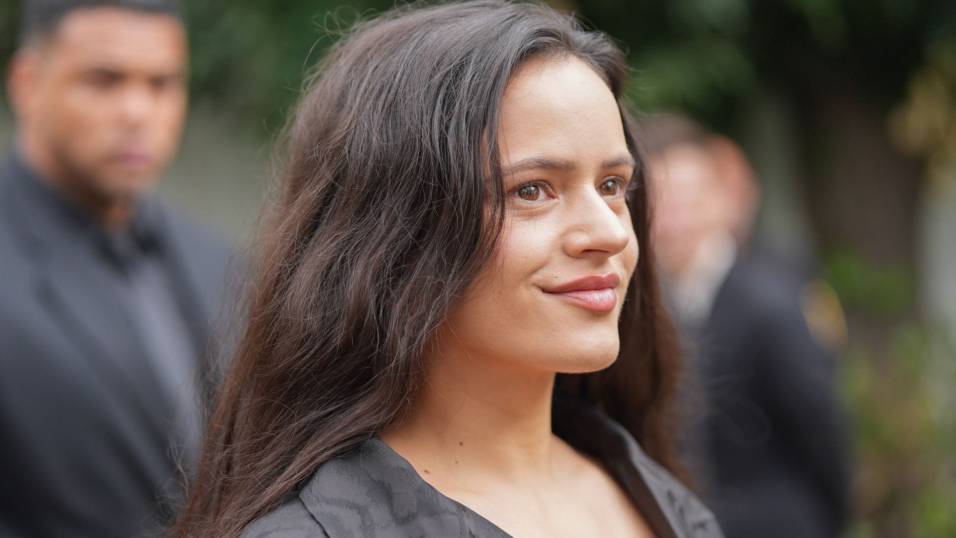 Rosalía turns heads in daring faux-plunge top and sleek high-slit skirt in Paris