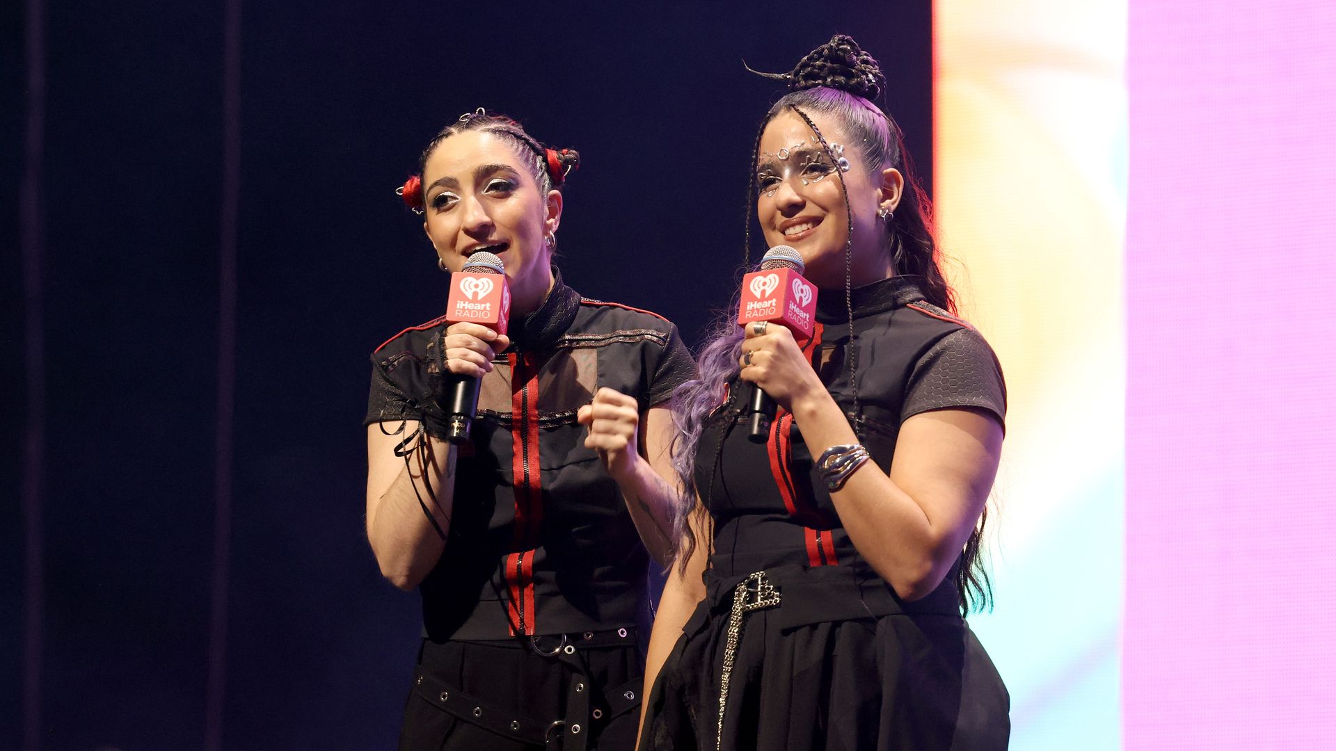 Emily Estefan and Gemeny Hernandez speak onstage during the 2024 iHeartRadio Fiesta Latina at Kaseya Center on October 26, 2024 in Miami, Florida.  (Photo by Alexander Tamargo/Getty Images)
