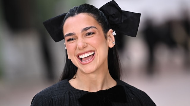 Dua Lipa poses in bridal white dress amid engagement rumors