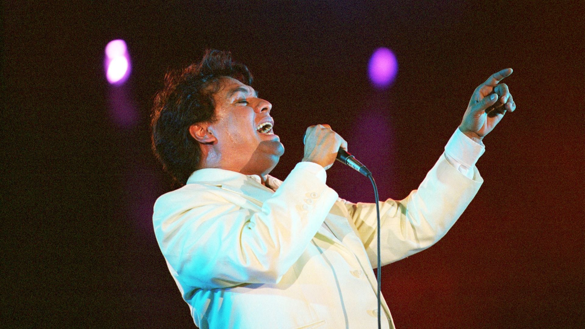 International music star Juan Gabriel sings June 26, 2000 during a concert in Ciudad Juarez, Mexico. The concert was organized by the Revolutionary Institutional Party in the hope of drawing support to the PRI's candidate for presidency, Francisco Labastida. (Photo by Joe Raedle/Newsmakers)