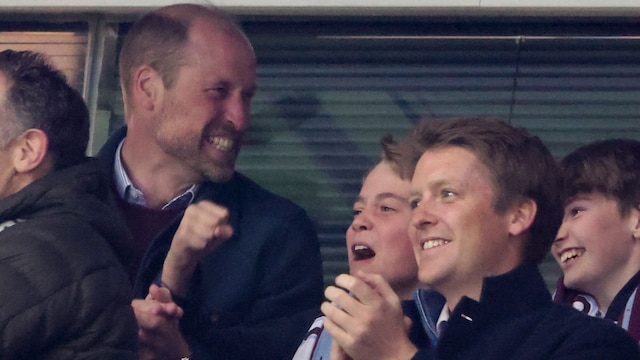 BIRMINGHAM, ENGLAND - APRIL 15: Prince William, Prince of Wales and Prince George of Wales, below right Hugh Grosvenor, Duke of Westminster celebrate the second goal of Aston Villa during the UEFA Champions League 2024/25 Quarter Final Second Leg football match between Aston Villa FC and Paris Saint-Germain (PSG) at Villa Park on April 15, 2025 in Birmingham, England. (Photo by Jean Catuffe/Getty Images)