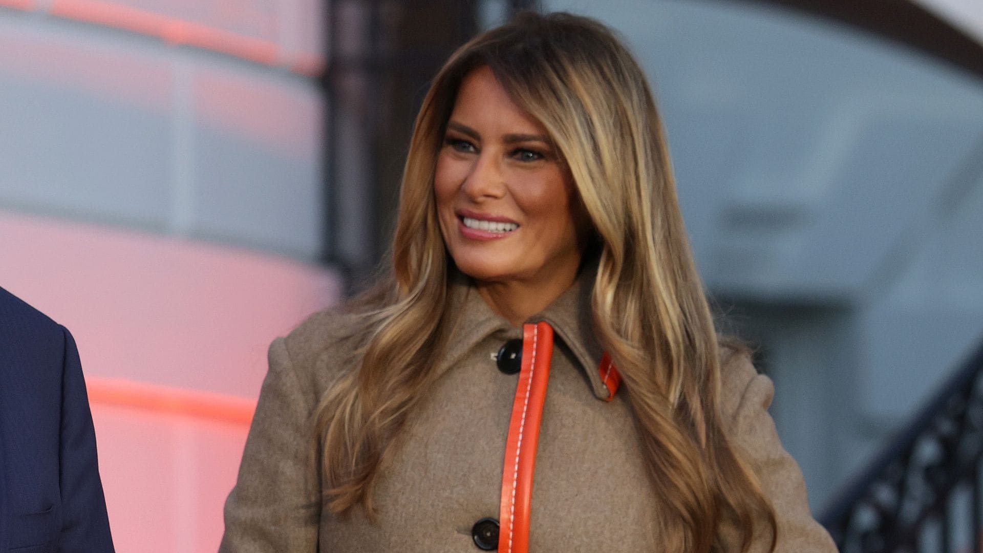 Melania Trump hands Halloween candy in luxe coat, no costume