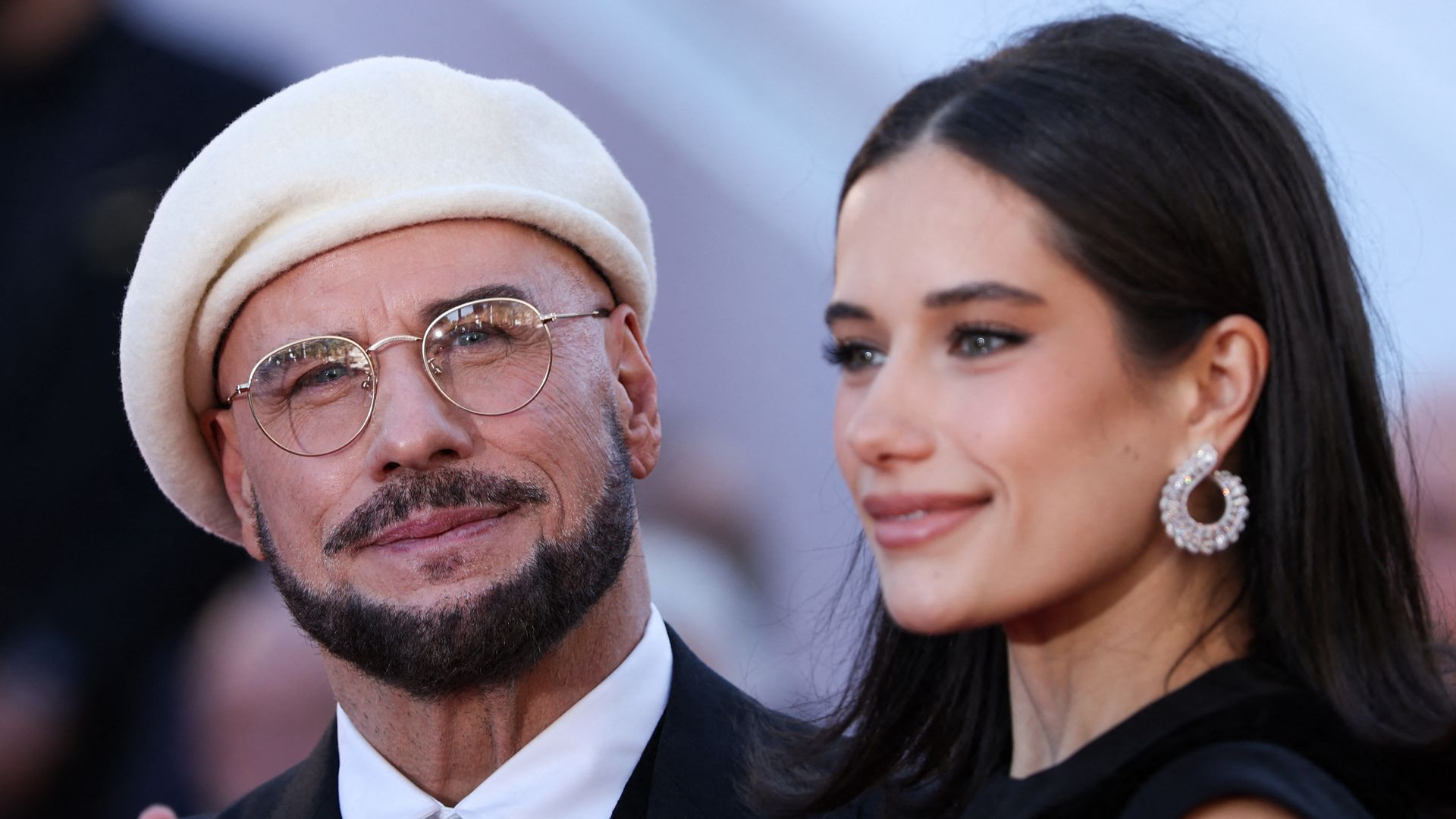 TOPSHOT - US director, screenwriter and writer John Travolta and US actress Ella Bleu Travolta arrive for the screening of the film "Propeller One-Way Night Coach" at the 79th edition of the Cannes Film Festival in Cannes, southern France on May 15, 2026. (Photo by Sameer AL-DOUMY / AFP via Getty Images)  