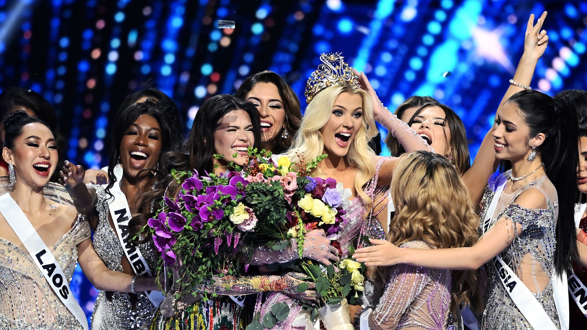 The newly crowned Miss Universe 2024, Victoria Kjaer Theilvig (C) from Denmark, reacts as she celebrates amid the other participants after winning the 73rd edition of the Miss Universe pageant in Mexico City