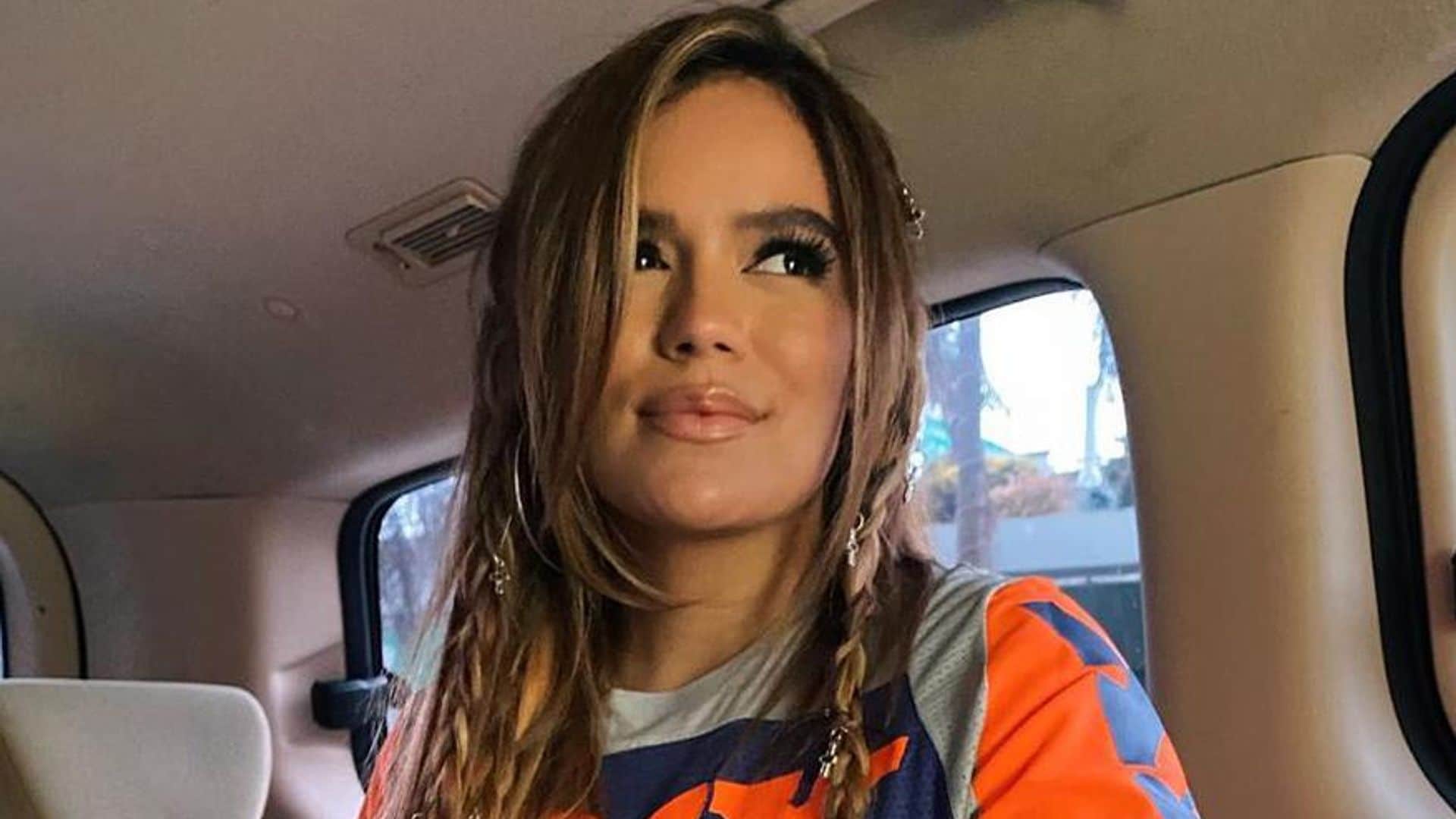 Karol G shows off cool braids and hair jewelry with trendy new look