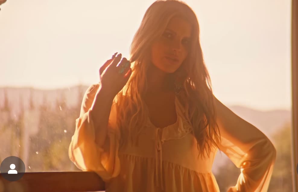 Jessica Simpson channels Y2K nostalgia in a sexy babydoll crop top while celebrating vinyl milestone