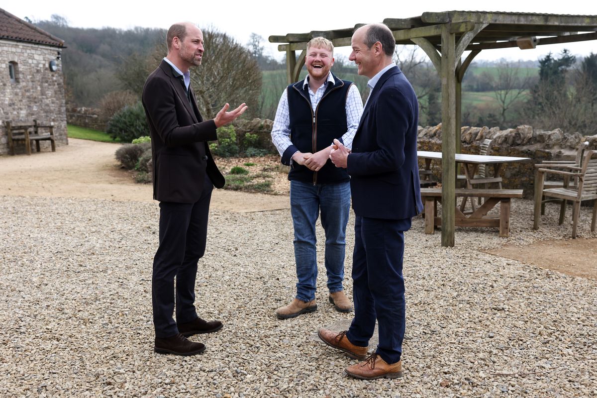 Prince William, Prince of Wales (L) speaks with Clarkson's Farm stars Kaleb Cooper (C) and Charlie Ireland (R)