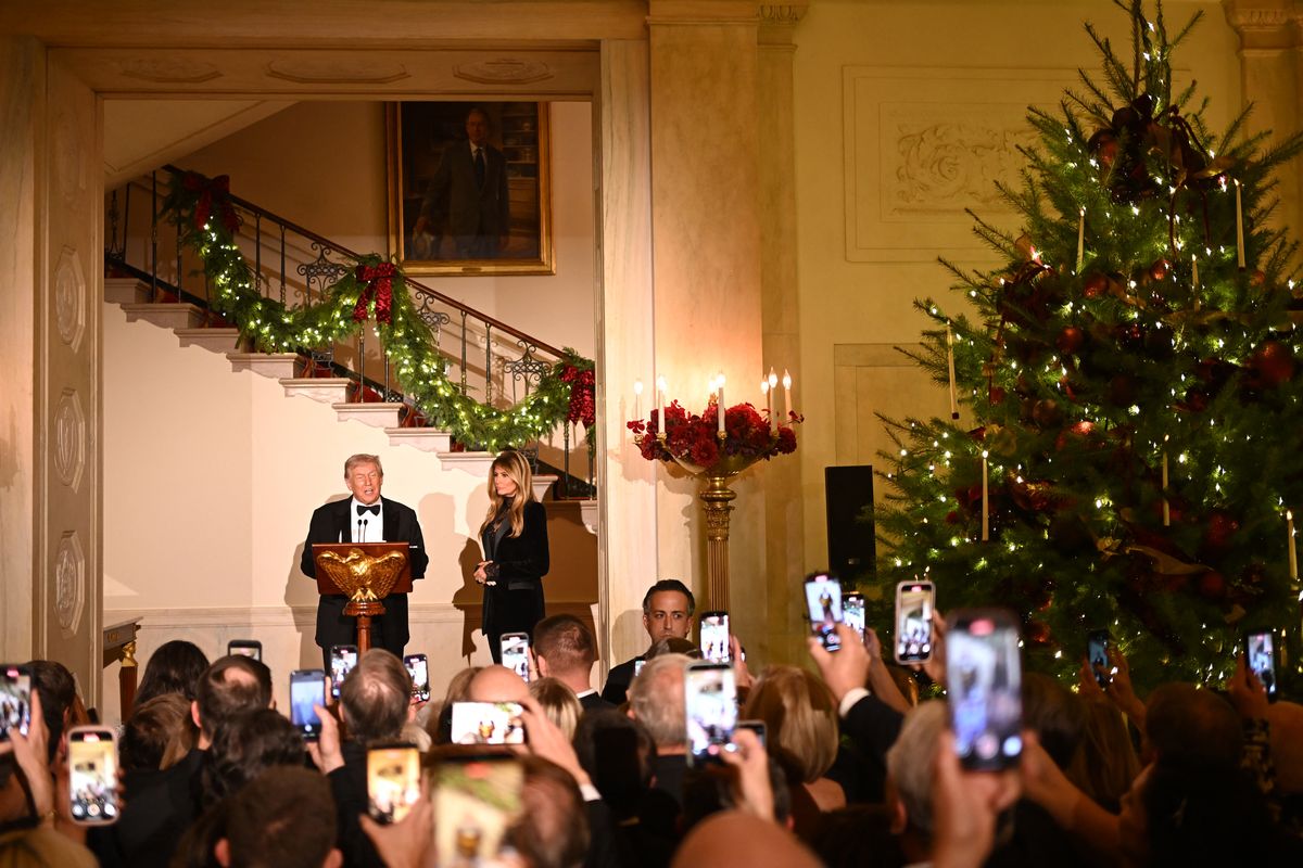 President Donald Trump, accompanied by First Lady Melania Trump, delivers remarks during the Congressional Ball in the Grand Foyer of the White House