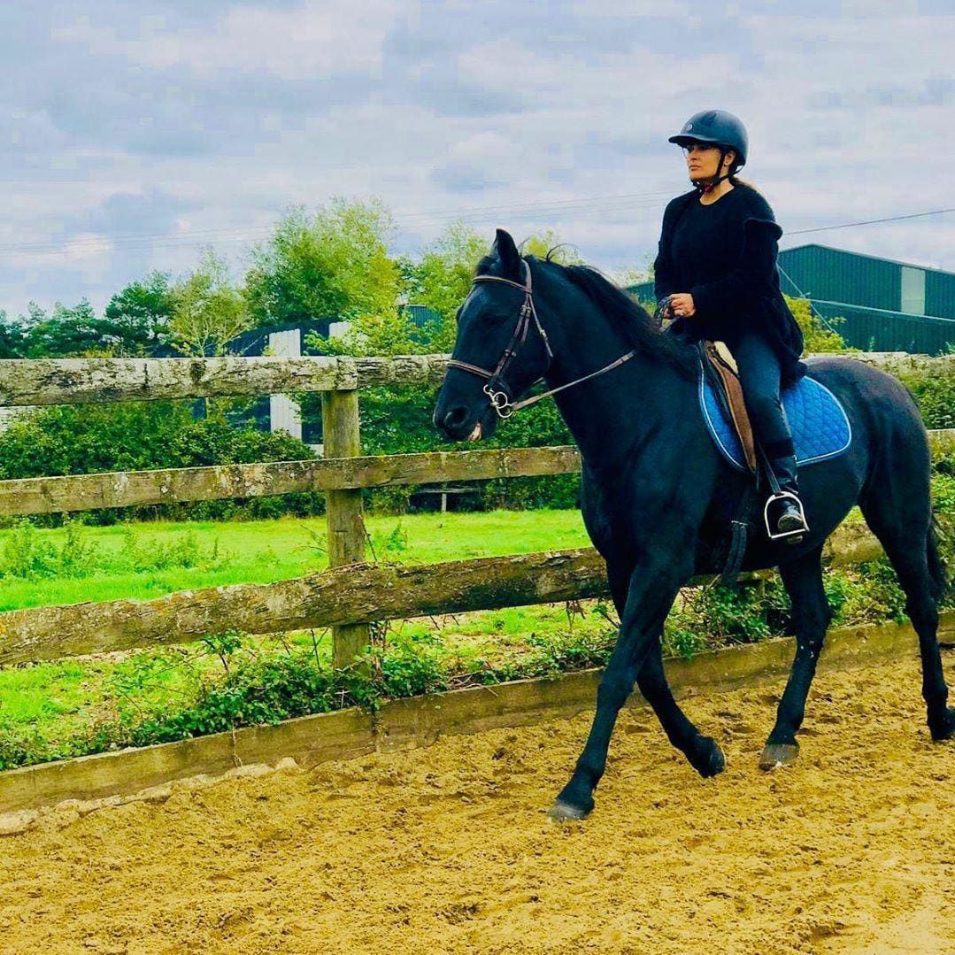 Salma Hayek rides horse country side