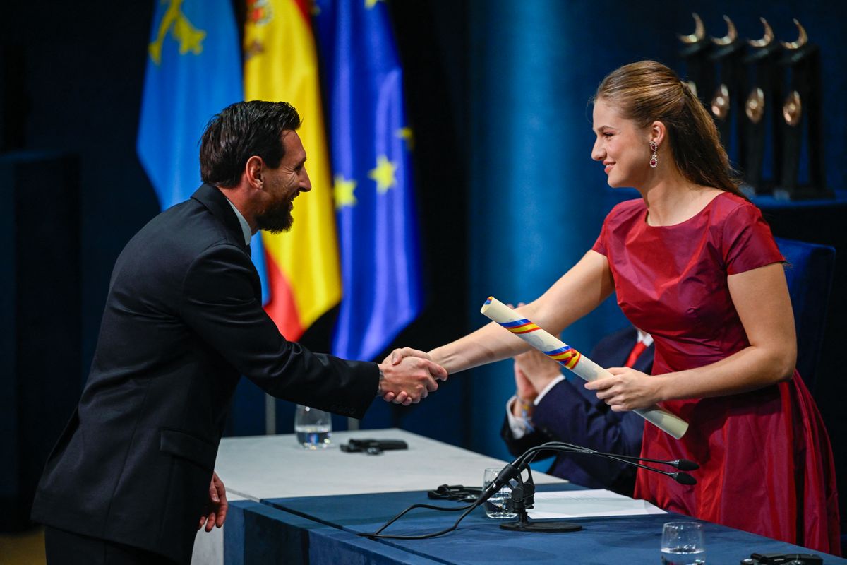 Spain's Princess Leonor shaking hands with Argentine football legend Lionel Messi as she awards him the 2026 Princess of Asturias Award for Sport