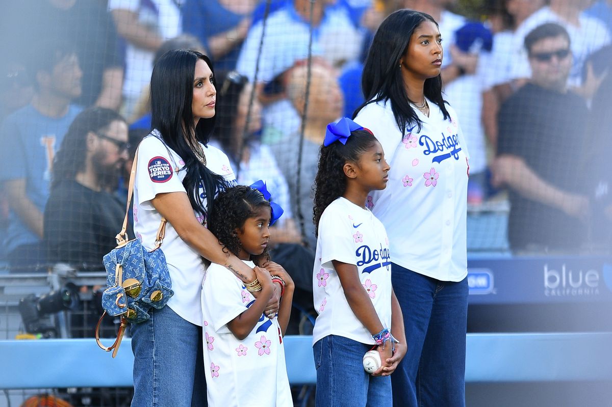 LOS ANGELES, CA - AUGUST 08: Vanessa Bryant,left with her children Capri, Bianka and Natalia look on during the national anthem on Kobe Bryant bobble head night prior to the MLB game between the Toronto Blue Jays and the Los Angeles Dodgers on August 8, 2025 at Dodger Stadium in Los Angeles, CA. (Photo by Brian Rothmuller/Icon Sportswire via Getty Images) 
