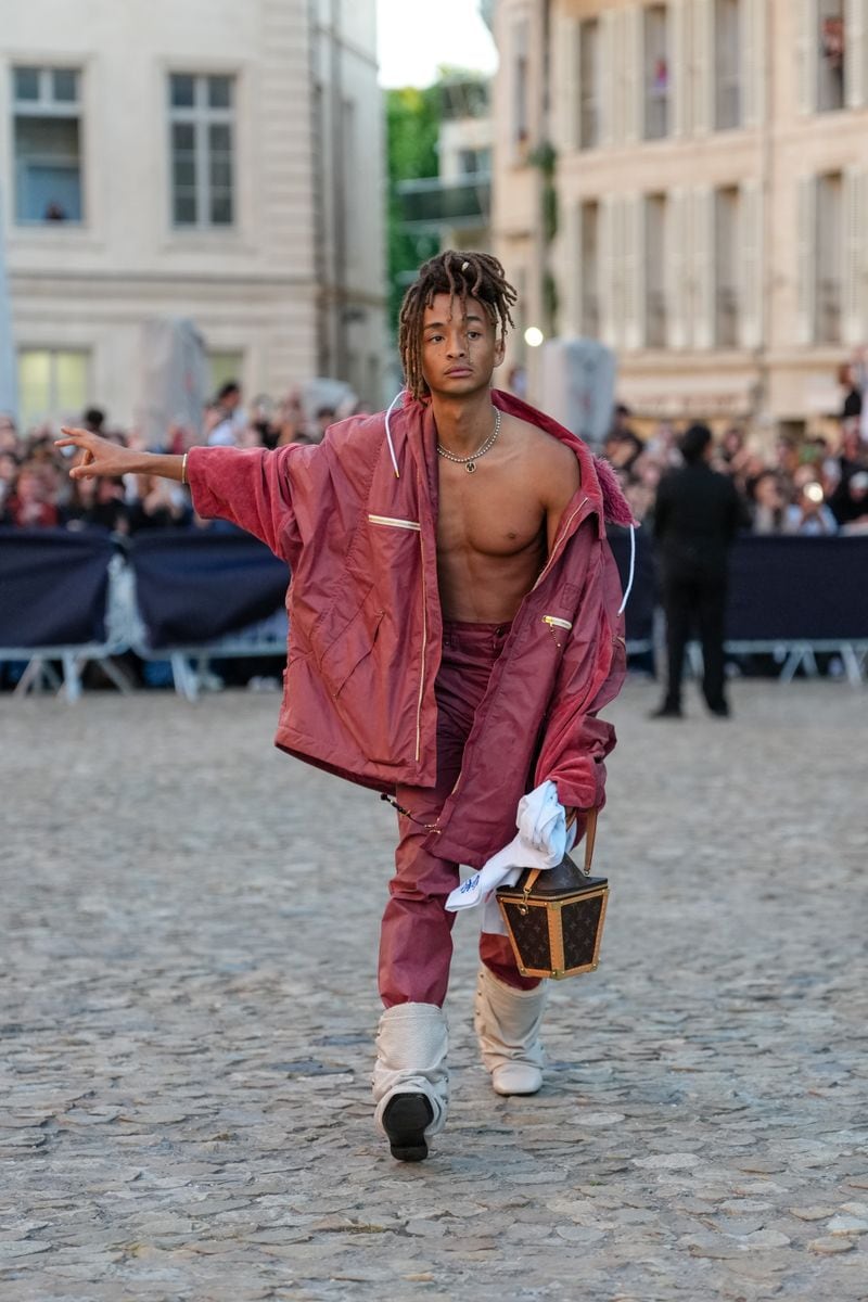 Jaden Smith wears a burgundy look during the Louis Vuitton Cruise 2026 at Palais Des Papes