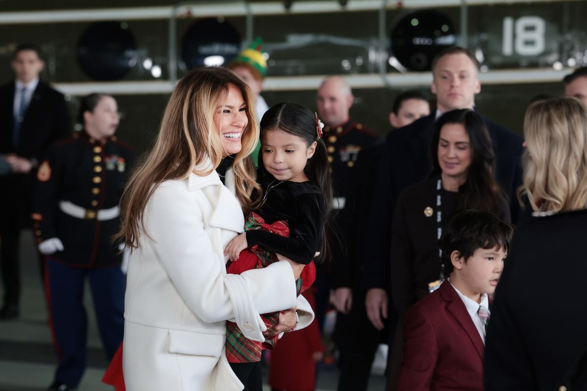 First lady Melania Trump visits with children of service members during a Toys for Tots Charity Drive at Marine Corps Base Quantico 