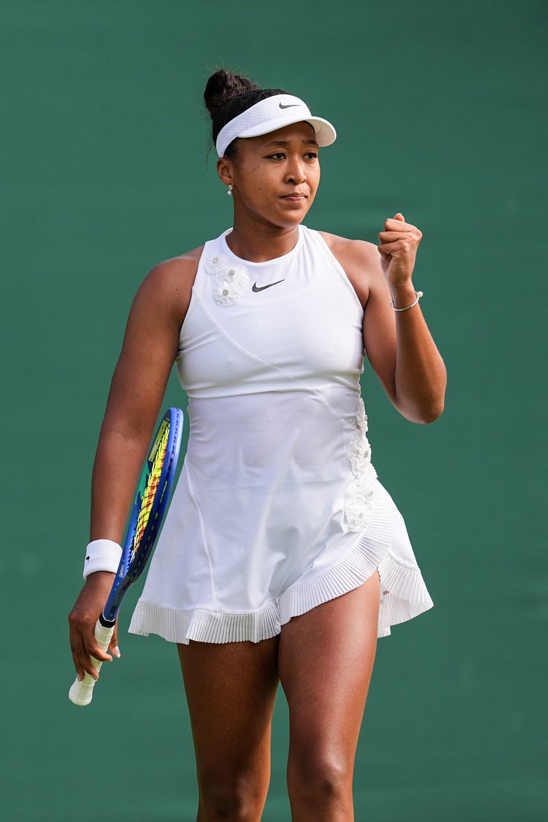 Naomi Osaka of Japan honored the tournament's strict all-white dress code while celebrating her Japanese heritage.