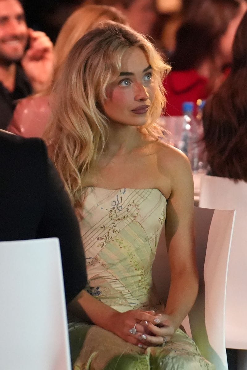 Sabrina Carpenter's dress skimmed her waist before floating out into a gently flared skirt.