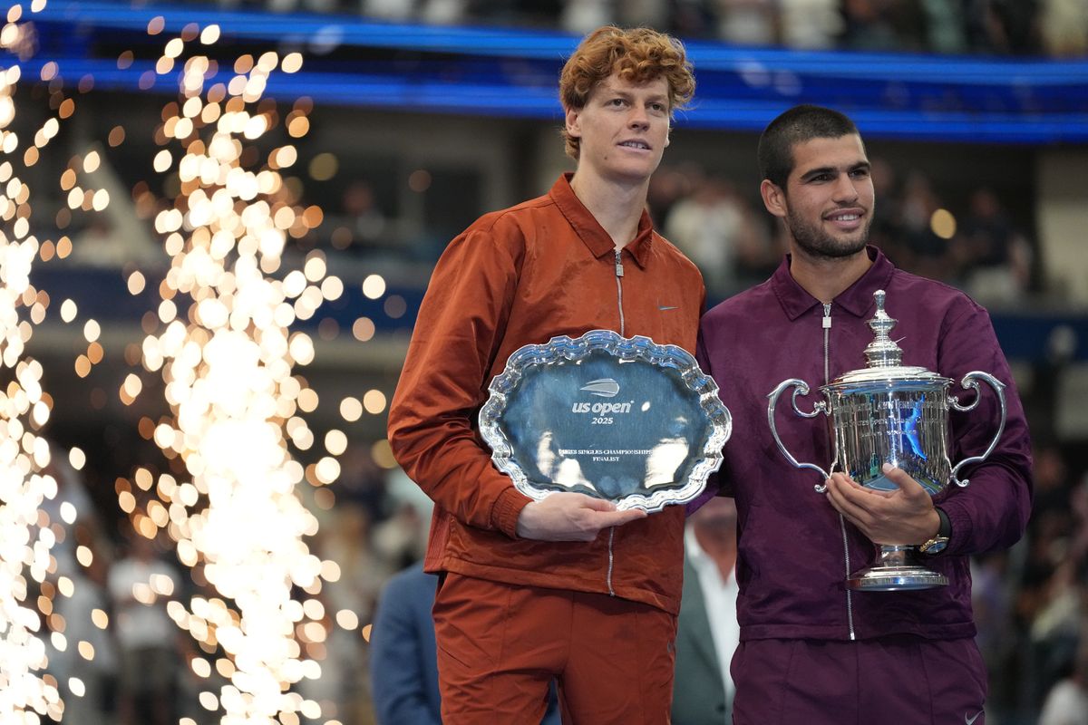 Winner Carlos Alcaraz of Spain and runner-up Jannik Sinner of Italy pose with trophies following the Men's Singles Final match