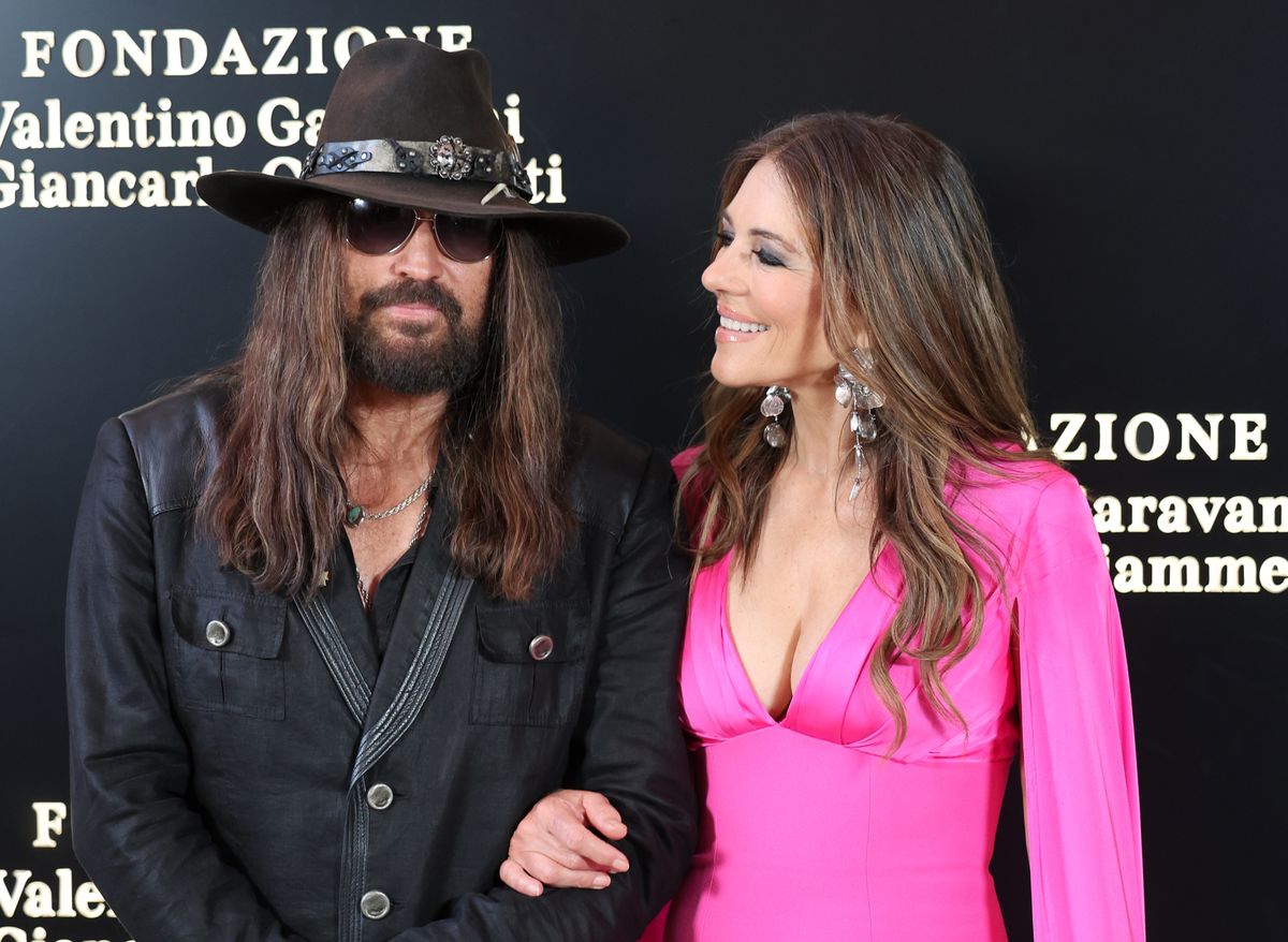  Billy Ray Cyrus and Elizabeth Hurley are seen arriving at the opening of the new Valentino Garavani space on May 24, 2025 in Rome, Italy. 