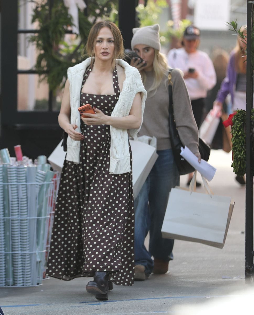 Lopez was seen wearing a stylish dress that she paired with a sweater and some boots