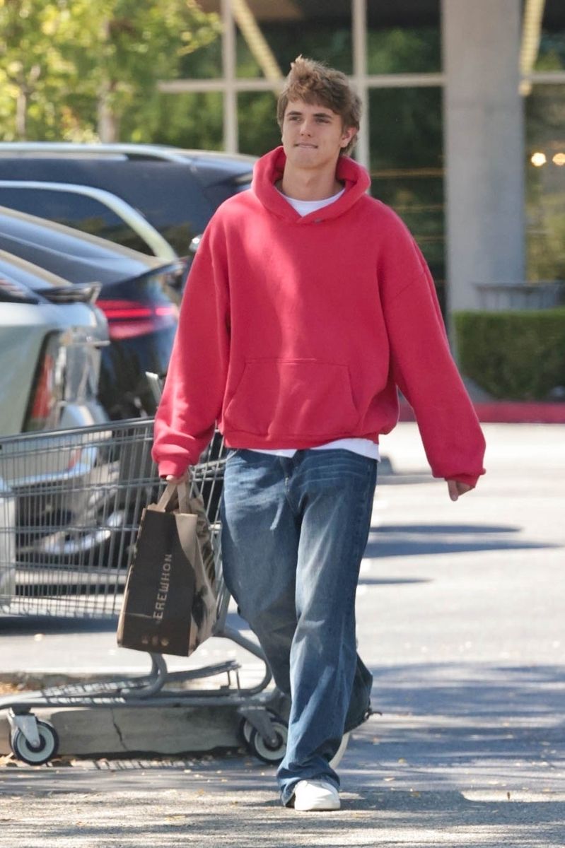 Britney Spears' son Jayden Federline kept it casual in an oversized red hoodie, loose-fit jeans, and white sneakers during an Erewhon stop.