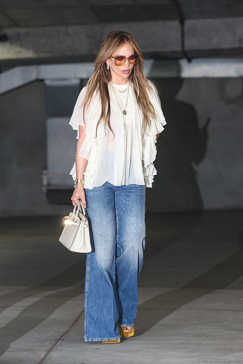 Jennifer Lopez is closing out summer and stepping into fall with her signature look and a seriously enviable handbag.