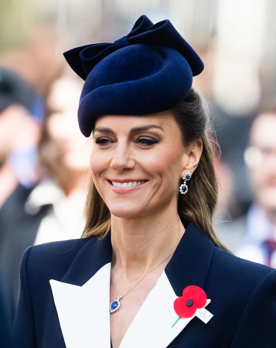 The Princess completes her look with a tanzanite and diamond necklace by G. Collins and Sons.