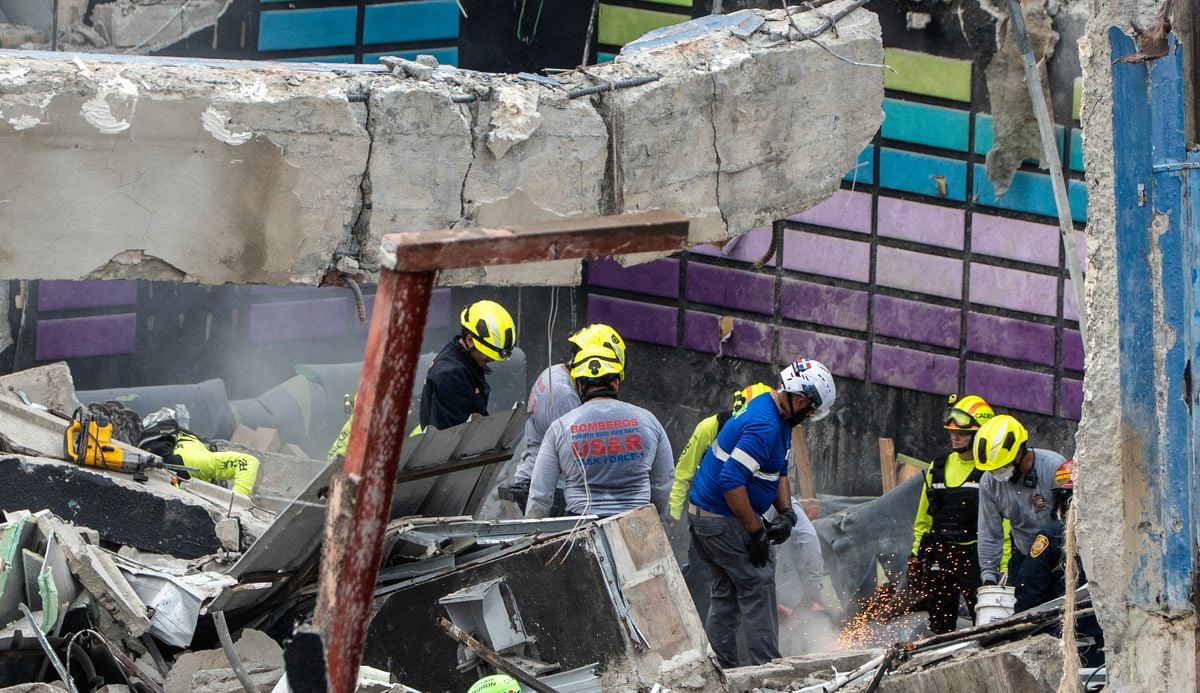 Rescue teams work at the Jet Set nightclub a day after the collapse of its roof in Santo Domingo on April 9, 2025. Rescuers raced to find survivors among the rubble of the nightclub where at least 113 people, including a former Major League Baseball star, were killed when the roof collapsed.
