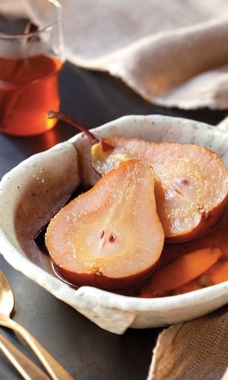 Chai-Poached Pears
Makes 4 servings
Ingredients:
2 cinnamon sticks
1 (2-inch) piece fresh ginger, crushed with a knife to crack the skin
20 cardamom pods, cracked
24 black peppercorns
4 firm but ripe medium-sized pears
Directions:
* In a pot large enough to hold the 4 pears, combine 10 cups water with the cinnamon sticks, ginger, cardamom, and peppercorns.
* Bring the water to a rolling boil, reduce the heat to maintain a simmer, cover, and continue simmering for 20 minutes to infuse the water with the spices.
* Wash the pears and cut them in half, leaving the peels on and cores and stems intact.
* Add the pears to the spice-infused water, cover the pot, and simmer until they are poached. They should be tender enough that a knife easily pierces them but they still hold their shape; this can take from 45 minutes to 2 hours. (The duration varies depending on the variety of the pears and the ripeness of the fruit.)
* Let sit in the poaching liquid, with the lid on the pot, for about 30 minutes until the pears are cool enough to serve. As the pears steep, the chai-spiced liquid will continue to infuse the fruit.
* To serve, plate two pear halves per person. Spoon some of the poaching liquid over the pears.
Each serving has 104 calories
Cook's Tip: The chai-spiced poaching liquid becomes a warming beverage when strained and served in a teacup. It's also refreshing served over ice in a tall glass with a cinnamon stick.