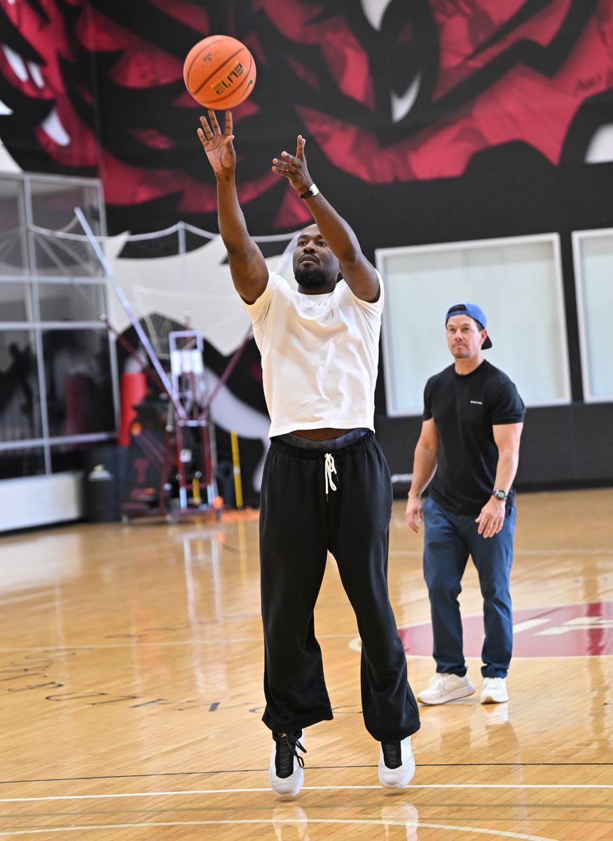Yahya Abdul-Mateen II and Mark Wahlberg shoot hoops at the "By Any Means" Philadelphia Press Day on August 15, 2026,