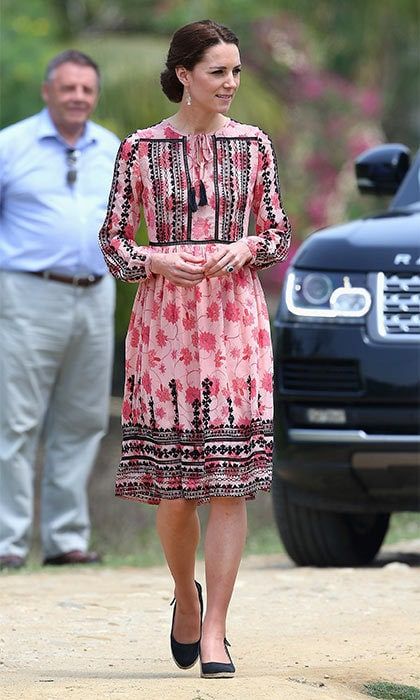 Kate wore a pretty pink dress from Topshop to attend the small village. She added some sparkle to the outfit with her Accessorize earrings.
<br>Photo: Getty Images