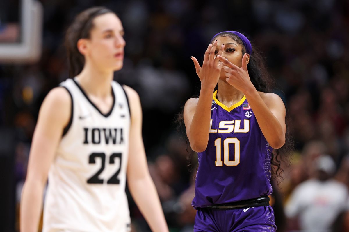 Angel Reese #10 of the LSU Lady Tigers reacts towards Caitlin Clark #22 