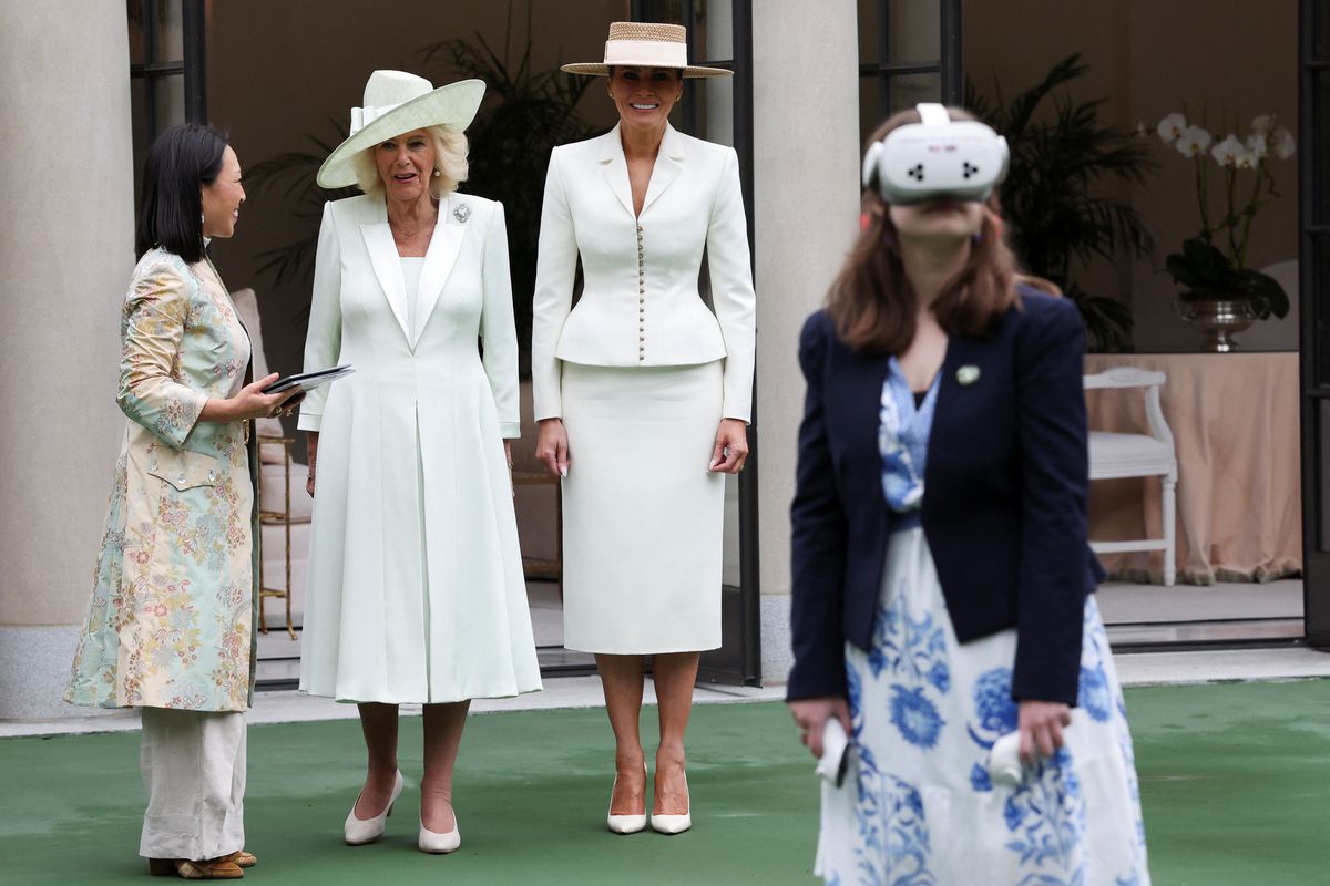First lady Melania Trump and Britain's Queen Camilla watch students using AI-enabled glasses. 