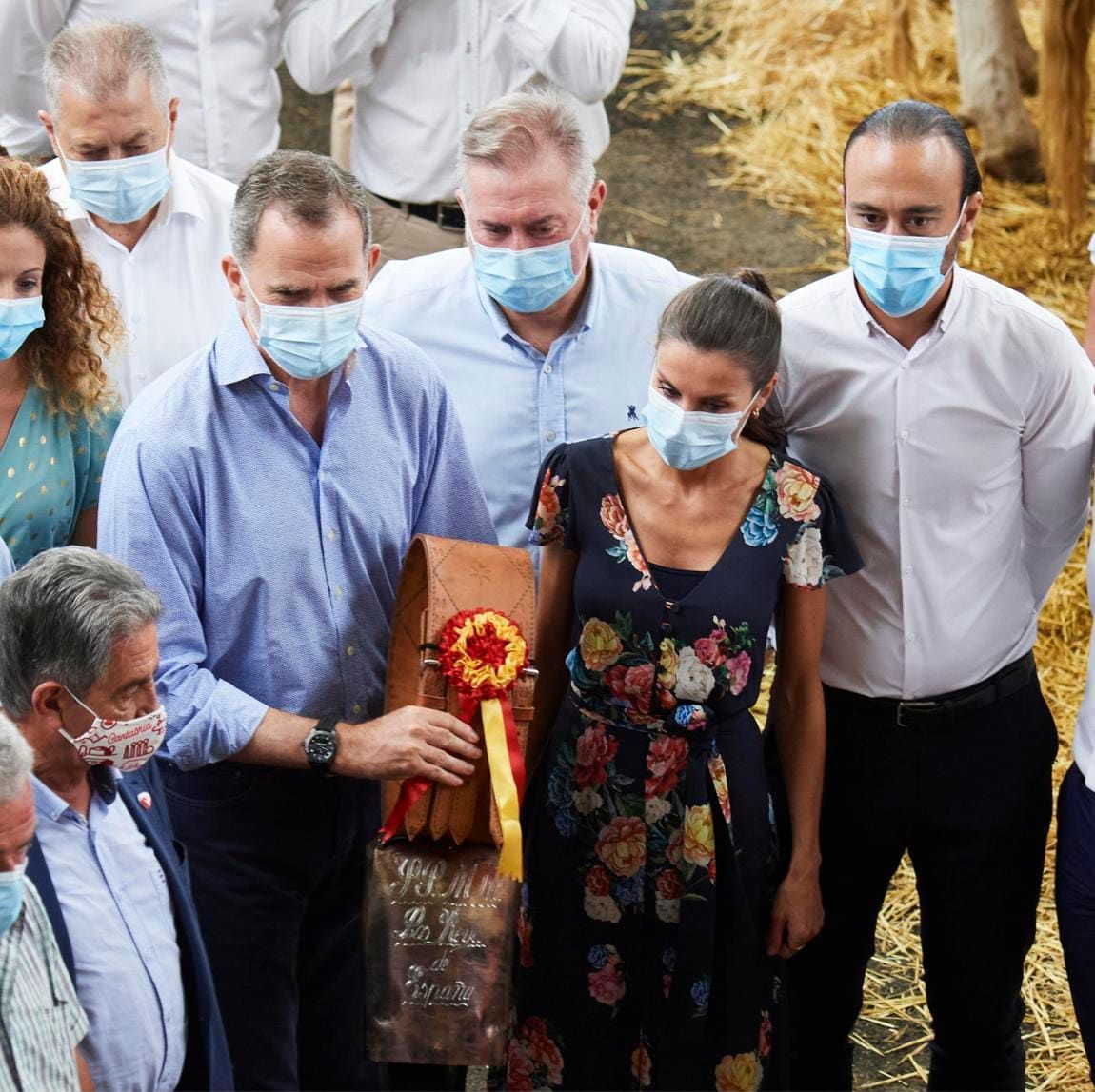 The royals were presented with a cow bell during their visit to the market