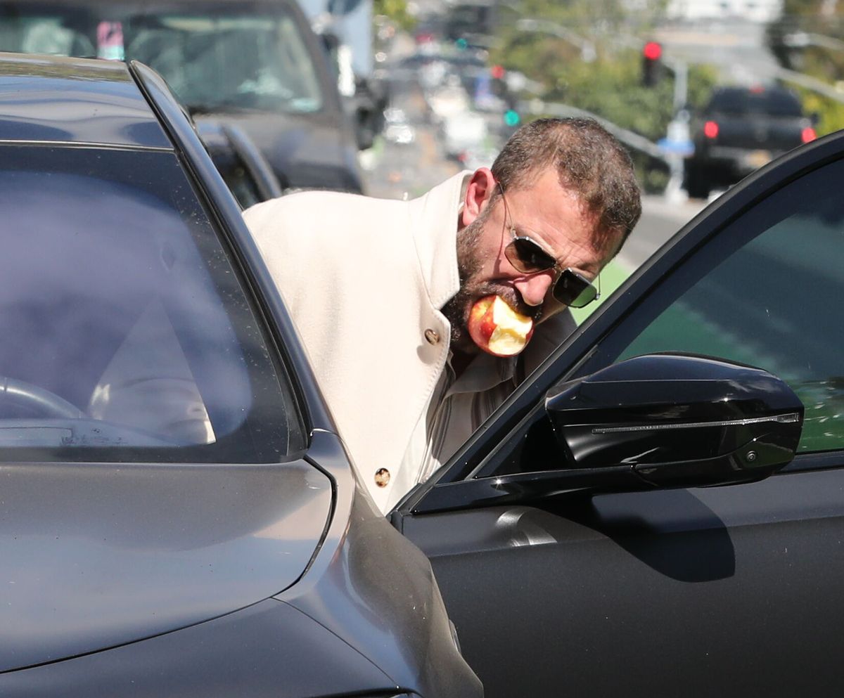 Ben Affleck joking around with an apple following the apple technique to stop smoking in Los Angeles April 25 2026.